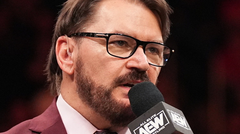 Tony Schiavone talks into his microphone