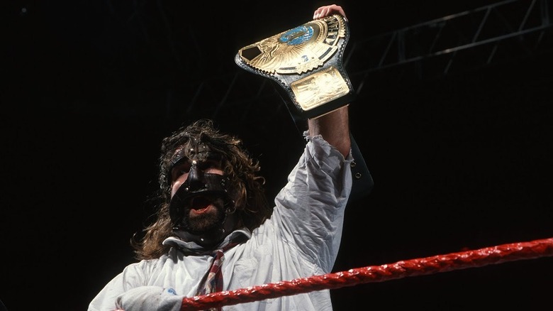 Mick Foley Holds Up WWF Title