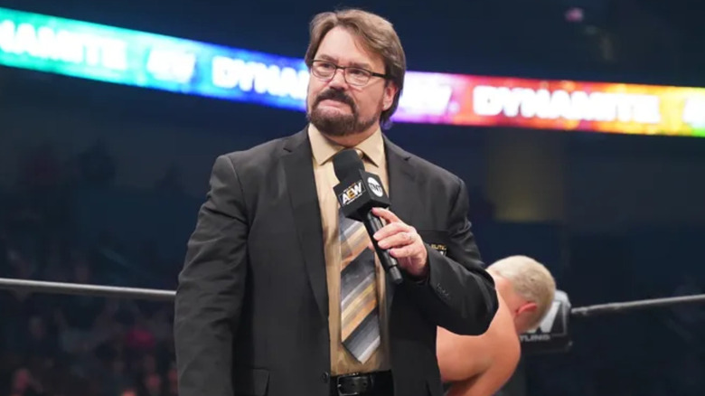 Tony Schiavone holding a microphone