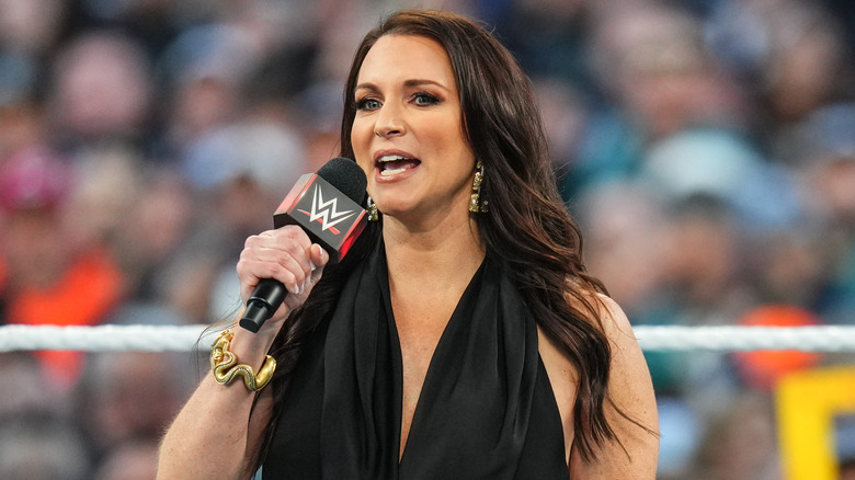 Stephanie McMahon holding a microphone