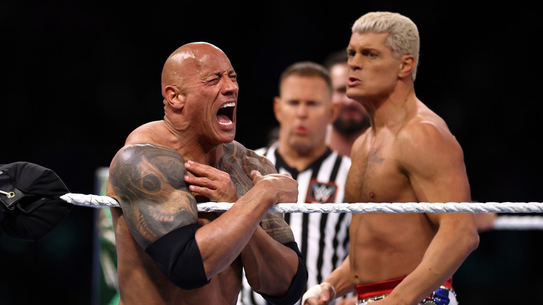 Dwayne "The Rock" Johnson reacts during a tag team fight with Romain Reigns against Cody Rhodes and Seth "Freakin" Rollins during Night One of WrestleMania 40 at Lincoln Financial Field on April 06, 2024 in Philadelphia, Pennsylvania.