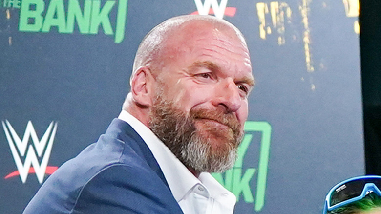 Triple H grins