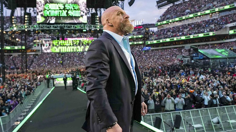Triple H looks up at the crowd