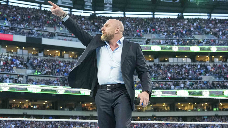 Triple H points to the WrestleMania sign to kick-off the festivities last year