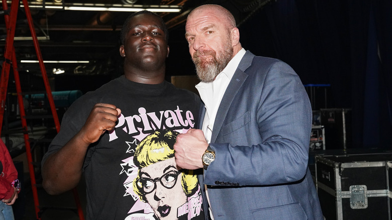 Triple H standing with Jacob Henry