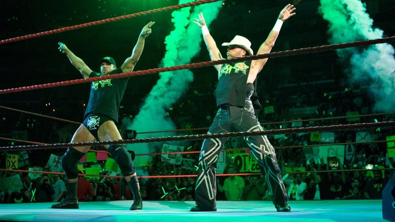 D-Generation X performing their pyro taunt in the ring