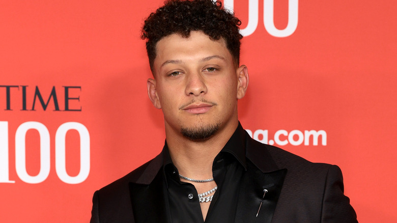 Patrick Mahomes wearing a black suit