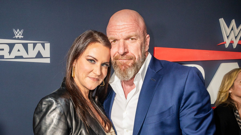 Stephanie McMahon and Triple H posing