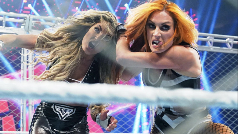 Trish Stratus wrestling Becky Lynch in a cage