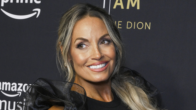 Trish Stratus posing on a red carpet