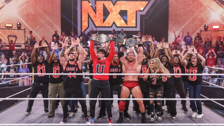 Andre Chase and Ridge Holland hold up the NXT Tag Team Championships after defeating Nathan Frazer and Axiom in the main event of an episode of "WWE NXT."