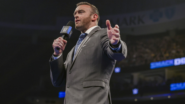 Nick Aldis with a microphone