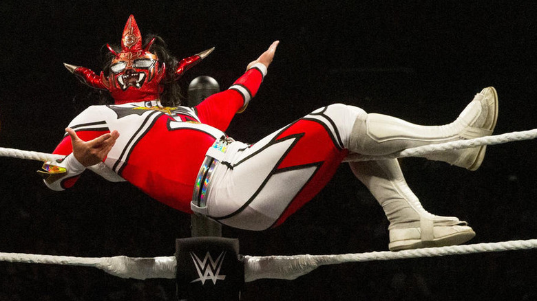 Jushin Thunder Liger sitting on the ring ropes