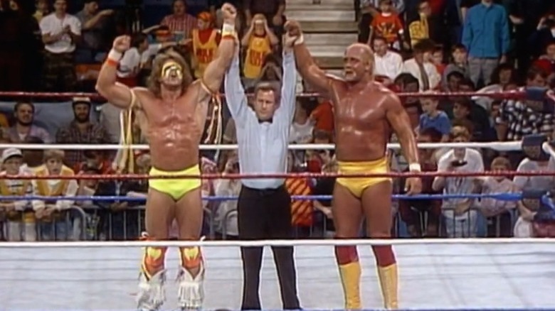 Ultimate Warrior Hulk Hogan arms raised