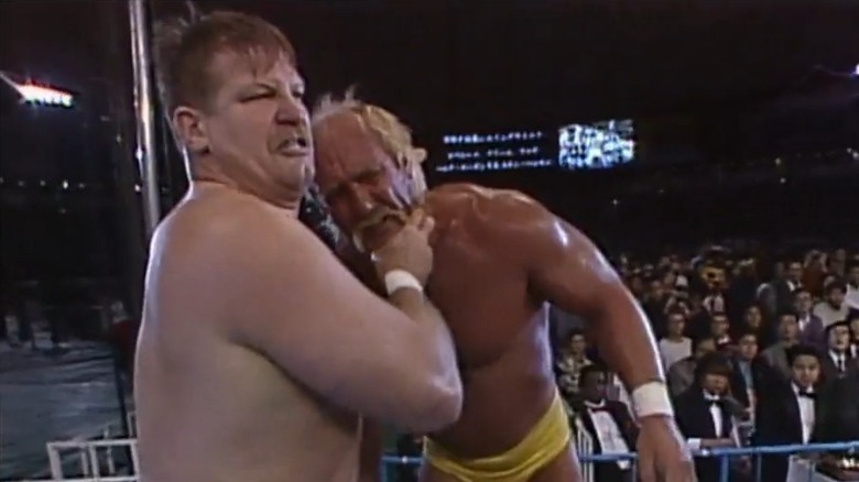 Stan Hansen grabbing Hulk Hogan