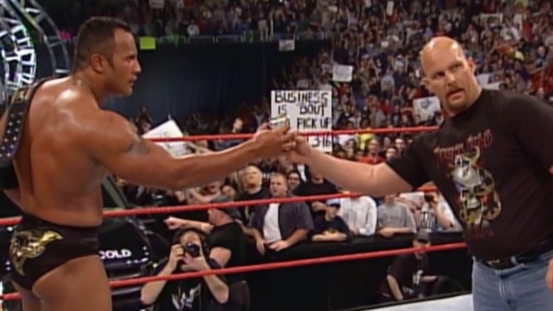 The Rock and Stone Cold share a beer