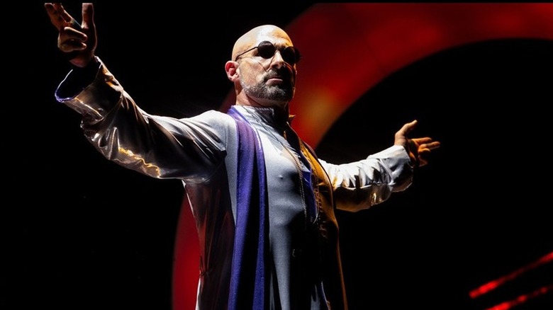 Christopher Daniels gives a pose to the crowd before wrestling his final match