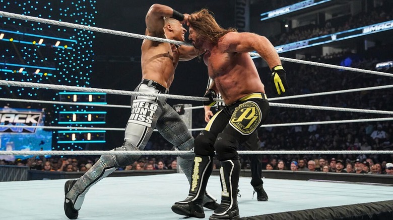 AJ Styles and Carmelo Hayes duke it out on the apron of the ring