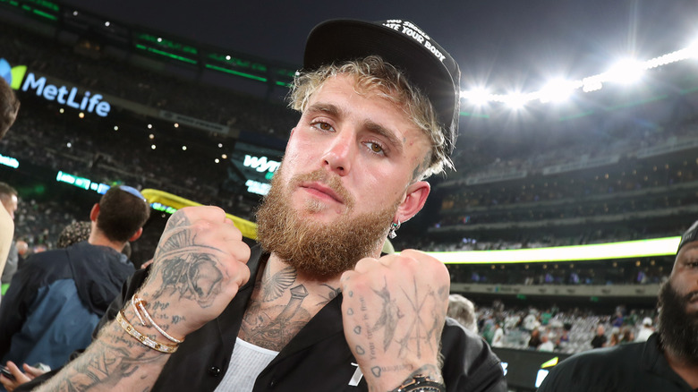 Jake Paul puts his fists up at an NY Jets game