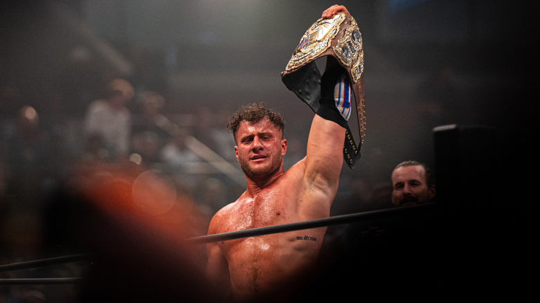 MJF holds up his custom title belt