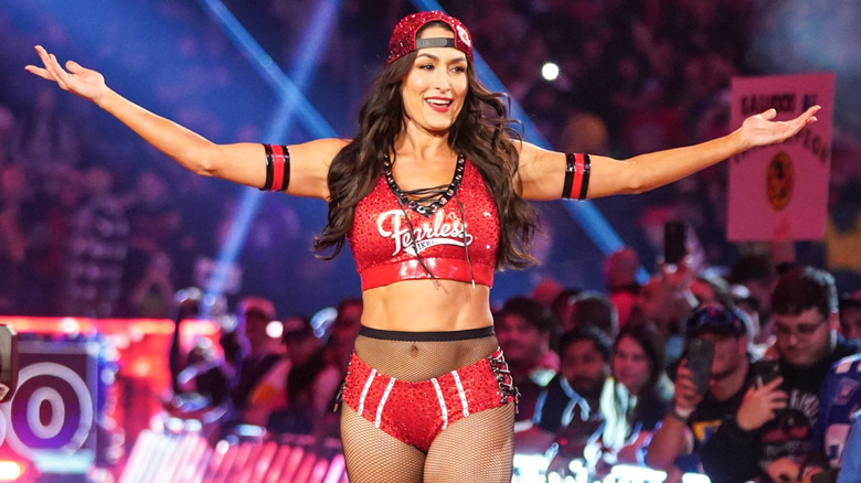 Nikki Bella wearing a red, bedazzled snapback hat