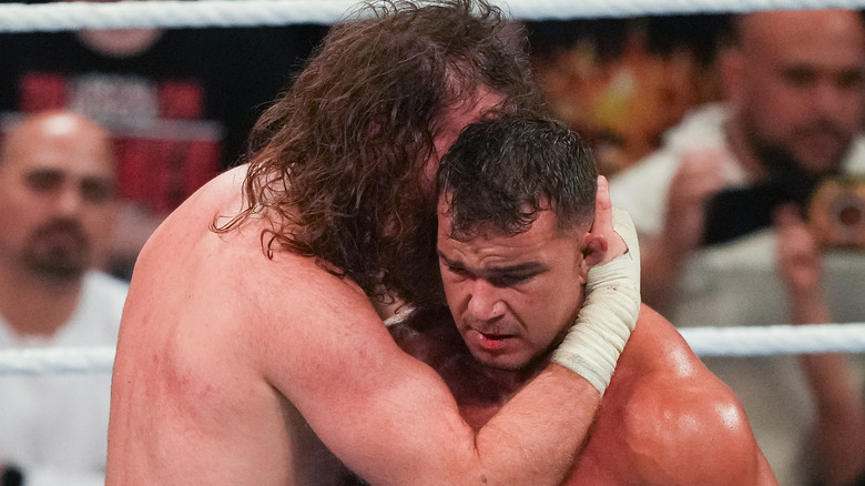 Sami Zayn consoles a dejected Chad Gable