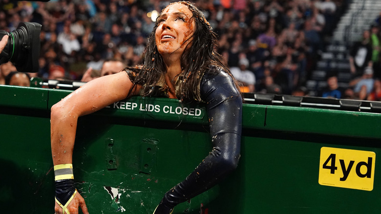 Chelsea Green in a dumpster covered in goo