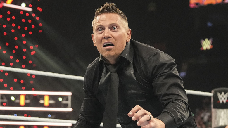 The Miz cowering