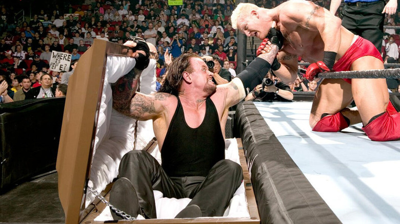 The Undertaker inside a casket