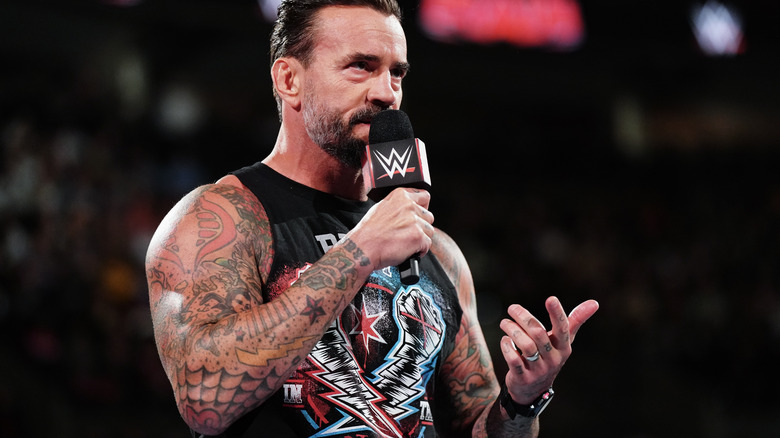 CM Punk holds a microphone