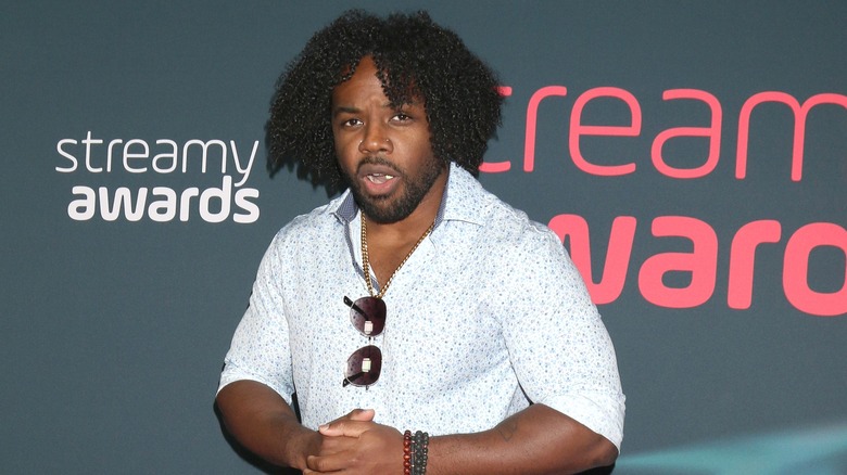 Xavier Woods poses on the Streamy Awards red carpet