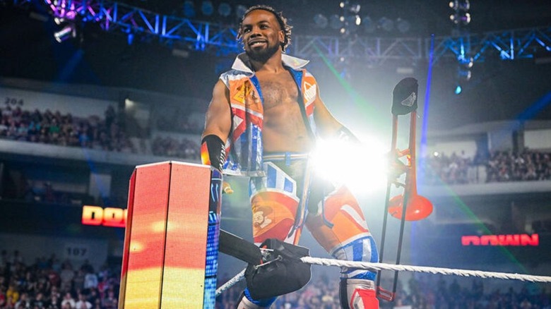 Xavier Woods stands in the turnbuckle with "Franchesca" the trombone before a match on "WWE SmackDown."