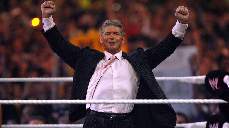 Vince McMahon raising arms