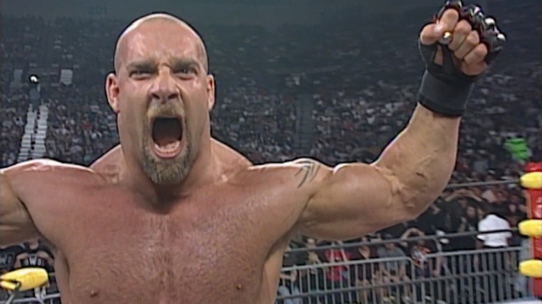 Goldberg roar and raises his arms in the ring at WCW Halloween Havoc 1997