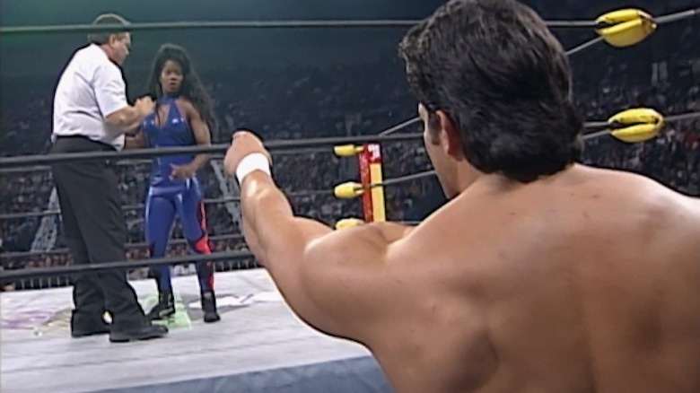 Disco Inferno points at Jacqueline in the ring at WCW Halloween Havoc 1997