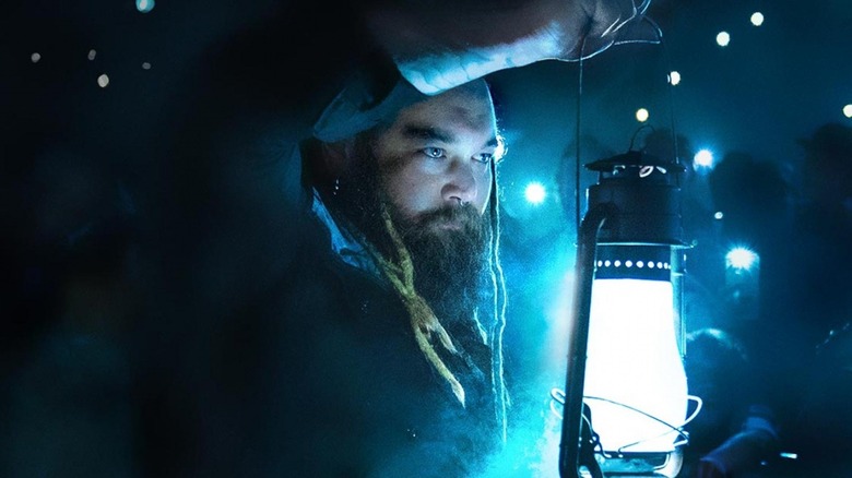 Bray Wyatt gazes through his lantern