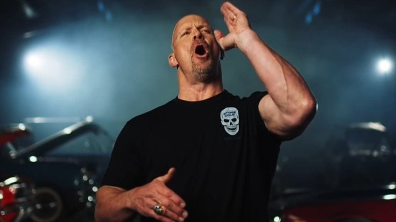 Steve Austin making a drinking motion