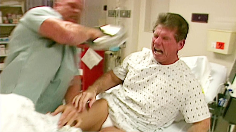 Stone Cold blasts Vince with a bedpan