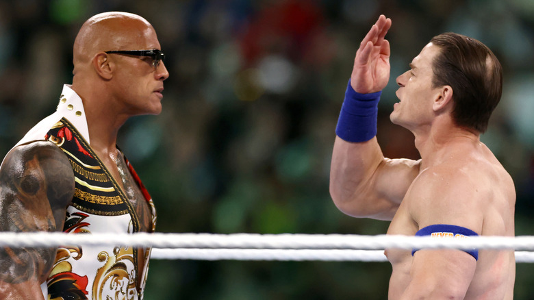 Dwayne "The Rock" Johnson and John Cena fight during Night Two at Lincoln Financial Field on April 07, 2024 in Philadelphia, Pennsylvania.