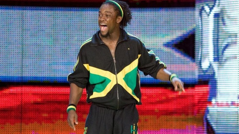 Kofi Kingston heads in to the ring, wearing Jamaican flag gear, for a match on WWE programming.