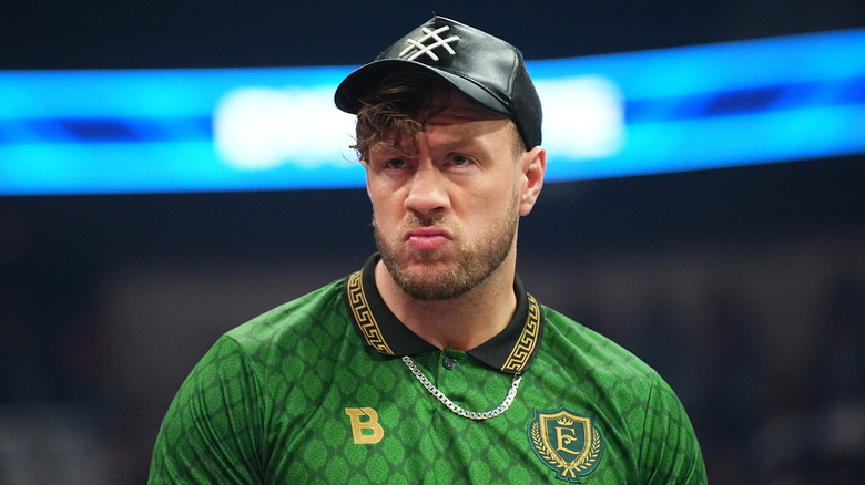 Will Ospreay wearing a United Empire-themed sports jersey