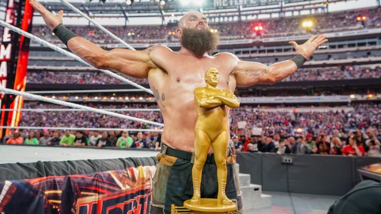 Braun Strowman poses in front of the Andre the Giant Memorial Battle Royal trophy