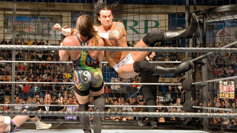 CM Punk his a flying clothesline on RVD inside the Extreme Elimination Chamber at WWE ECW December to Dismember