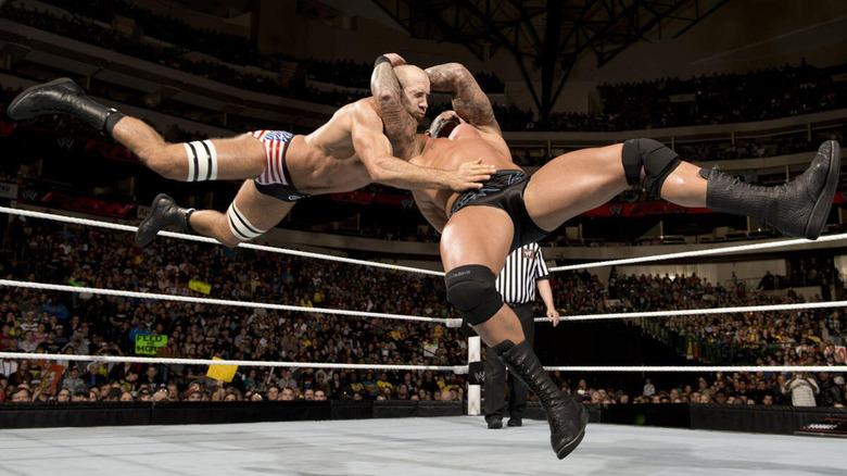 Randy Orton delivers an RKO to Cesaro.