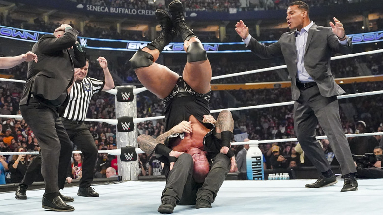 Kevin Owens delivering a piledriver to Randy Orton