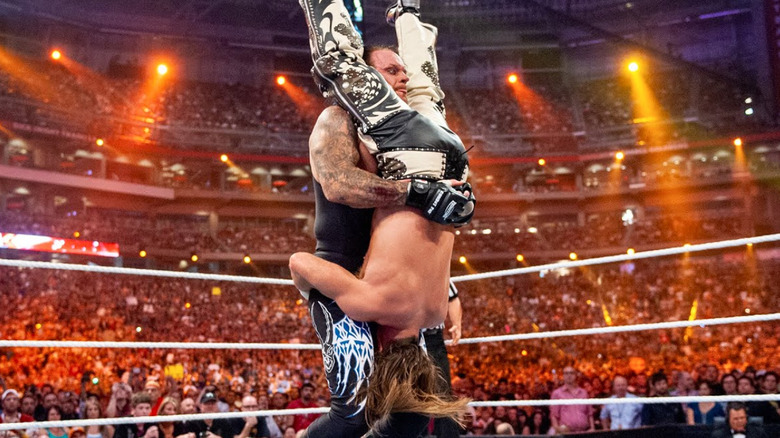 The Undertaker giving a Tombstone Piledriver to Shawn Michaels