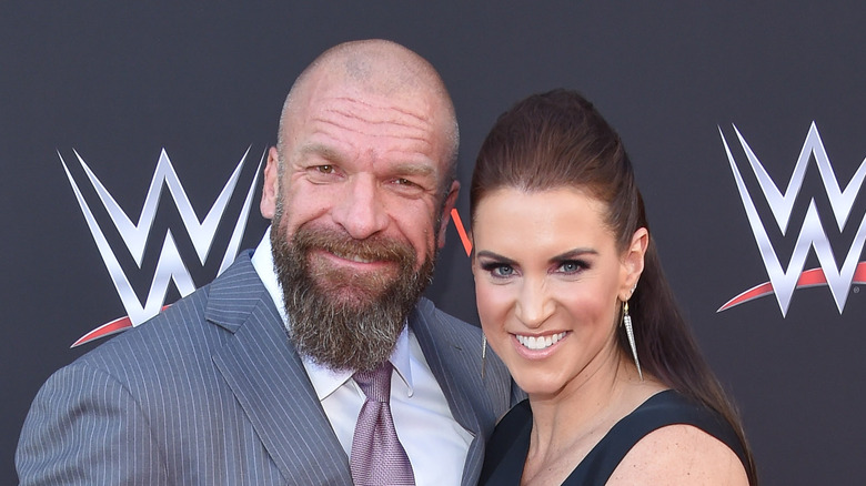 Stephanie McMahon and Triple H smile