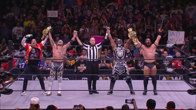 Death Triangle celebrating their title win