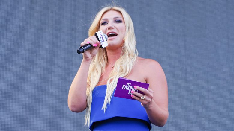 Brooke Hogan holding a microphone