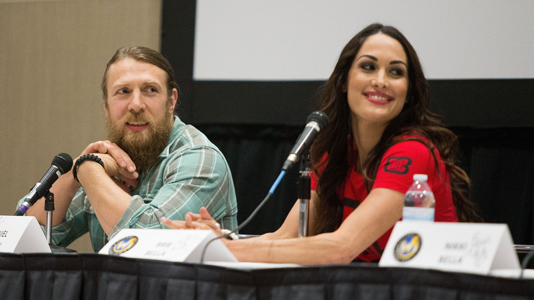 Bryan Danielson and Brie Danielson smiling 